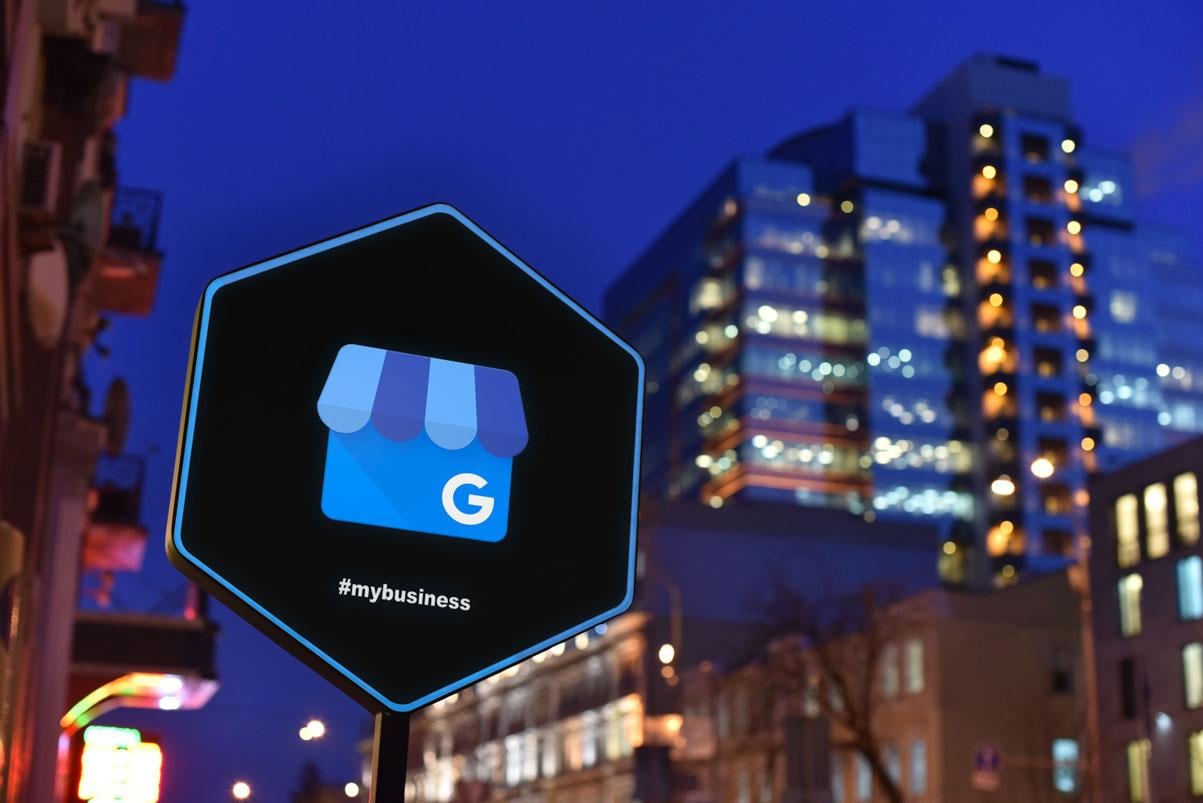 local seo tool google my business on city sign with city nightlife in background